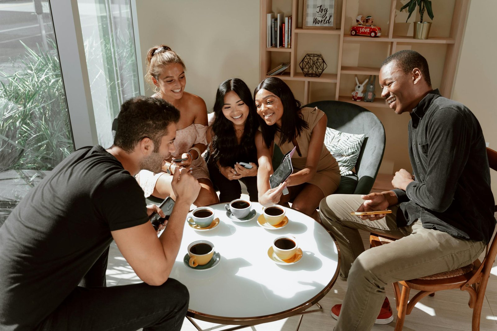 Travellers sharing coffee at a local café