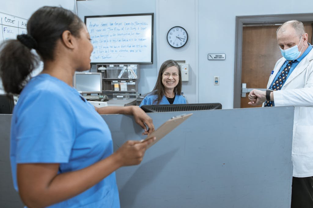 Doctors and nurses working together in a hospital, focused on patient care.