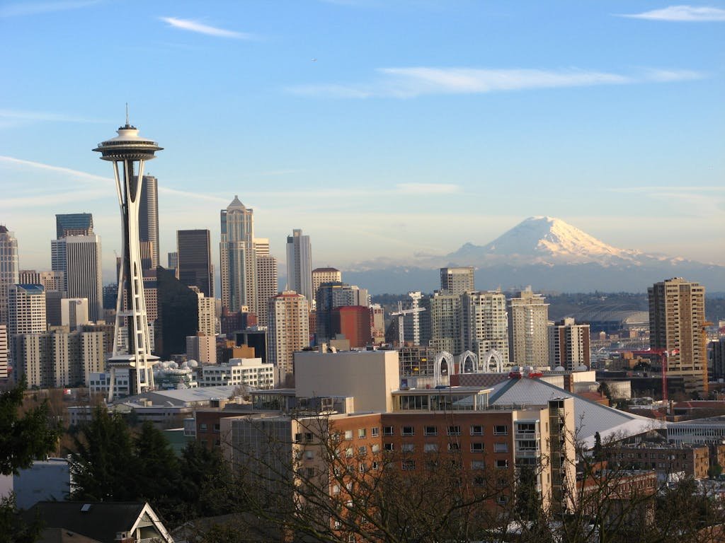 Stunning view of Seattle skyline featuring the Space Needle and Mount Rainier.