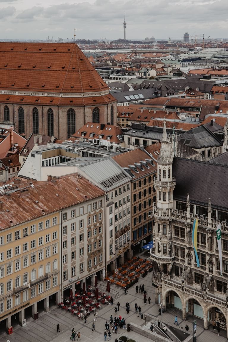 Aerial view showcasing historic Munich architecture and the Marienplatz square with a bustling atmosphere.